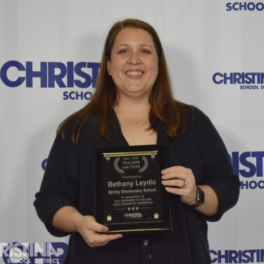 Photo of Bethany Leydic McVey ES Teacher of the Year with award